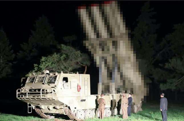 Kim Jong un inspecting the tracked multiple rocket launcher vehicle. Pixelation courtesy North Korea, which apparently prefers to keep the U.S. guessing how many rockets the vehicle can launch.