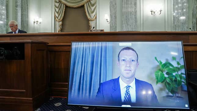 CEO of Facebook Mark Zuckerberg appears on a monitor as he testifies remotely during a hearing to discuss reforming Section 230 of the Communications Decency Act with big tech companies on October 28, 2020 in Washington, DC.