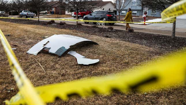 Pieces of an airplane engine from Flight 328 sit scattered in a neighborhood on February 20, 2021 in Broomfield, Colorado. 