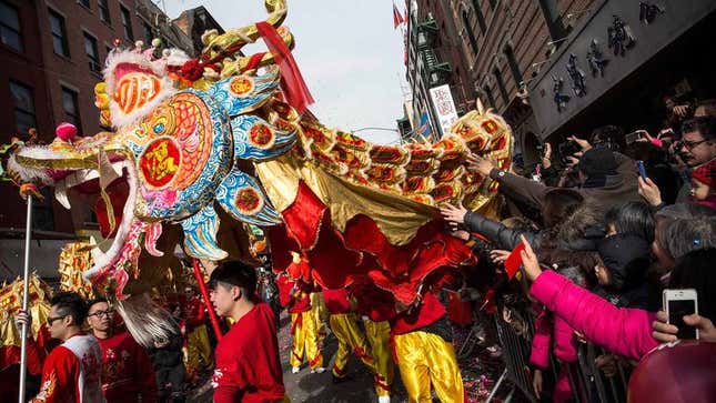 Image for article titled Everyone In Bustling Chinese Parade Attempting To Elude Pursuers
