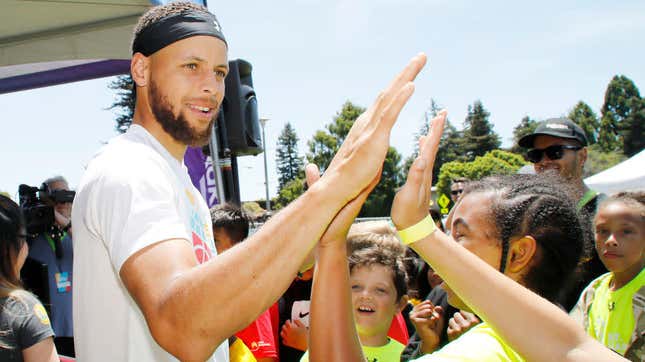 Steph Curry greeting kids at the launch of his Eat. Learn. Play. Foundation on July 18, 2019, in Oakland, Calif. 