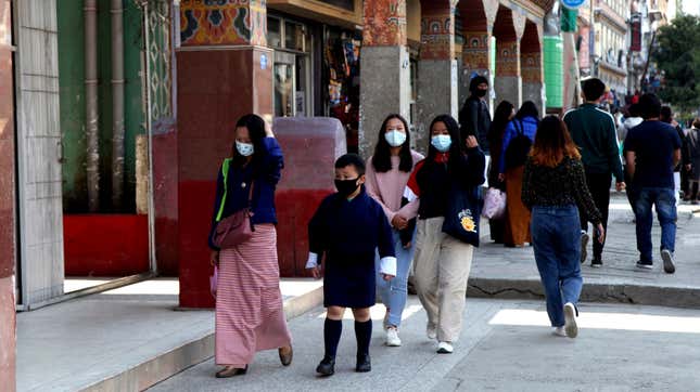 People walking down a street in Thimpu, Bhutan on Monday, April 12, 2021.