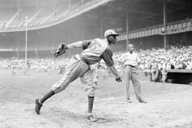 In this Aug. 2, 1942, file photo, Kansas City Monarchs pitcher Leroy Satchel Paige warms up at New York’s Yankee Stadium before a Negro League game between the Monarchs and the New York Cuban Stars.