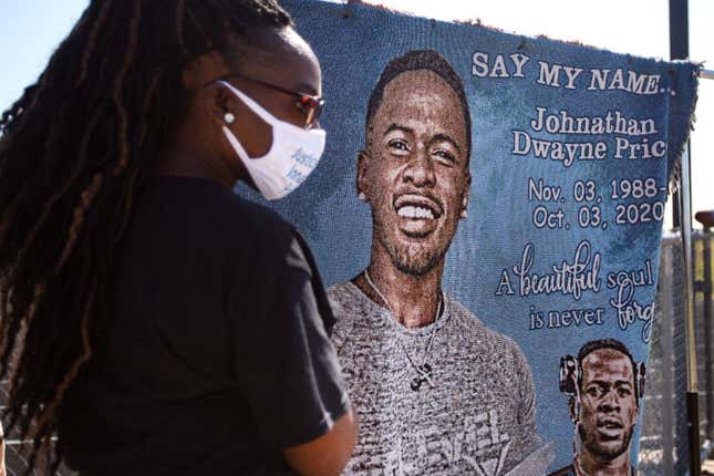 Mourners attend a funeral service for Jonathan Price at Wolfe City High School Football Field on October 10, 2020 in Wolfe City, Texas. Price, 31, was fatally shot by Wolfe City police officer Shaun Lucas on October 3, 2020 after Price was allegedly trying to stop a domestic dispute. 