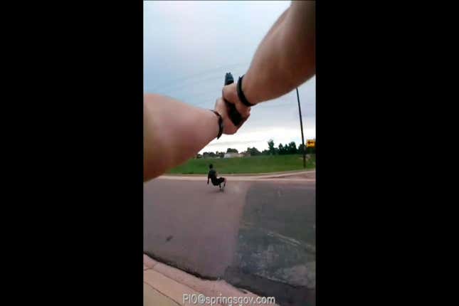 This Aug. 3, 2019 photo from police body camera video from the Colorado  Springs, Colo., Police Department shows De’Von Bailey, 19, falling as he  is hit by gunfire. A police official said Friday, Aug. 16, 2019, that  two Colorado Springs Police Department officers Sgt. Alan Van’t Land and  Officer Blake Evenson who were put on leave after shooting Bailey as he ran away from them have returned to active duty.