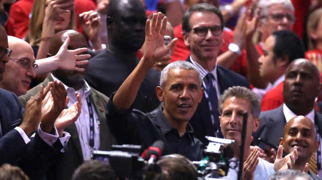 Barack Obama waves to the crowd during Game 2 of the NBA Finals between the Golden State Warriors and the Toronto Raptors at Scotiabank Arena on June 02, 2019, in Toronto.