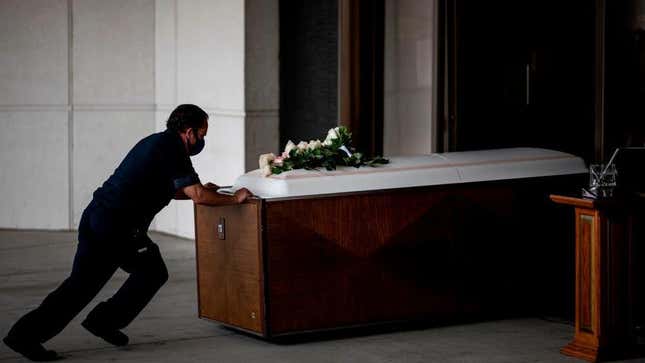 A worker pushes the coffin of Francia Nelly, from Ecuador, who died of complications related to covid-19, in Queens on June 5, 2020 in New York City.