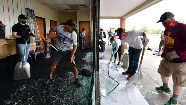 Volunteers clean up a restaurant in Minneapolis