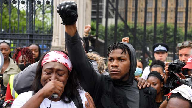 John Boyega stands in Parliament square during an anti-racism demonstration in London, on June 3, 2020