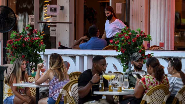 A restaurant on Ocean Drive in Miami Beach, Florida serves customers who apparently have no idea there’s a pandemic going on (July 14, 2020).