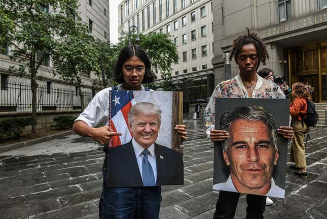 A protest group called “Hot Mess” hold up signs of Jeffrey Epstein and President Donald Trump in front of the Federal courthouse on July 8, 2019 in New York City. 