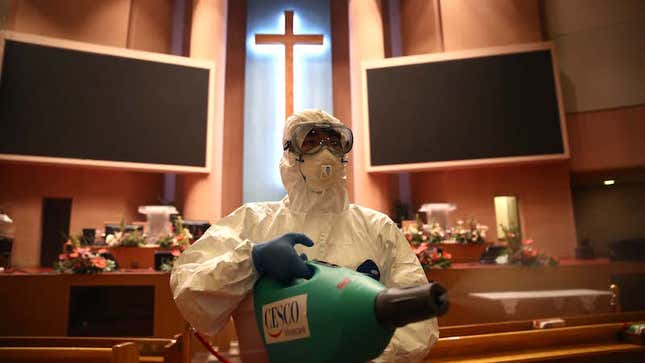 A disinfection worker wearing protective clothing sprays antiseptic solution in a Yoido Full Gospel Church amid concerns over the spread of coronavirus on August 21, 2020 in Seoul, South Korea.