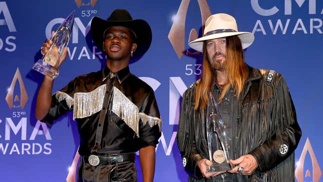 Lil Nas X (L) and Billy Ray Cyrus pose in the press room of the 53rd annual CMA Awards on November 13, 2019 in Nashville, Tennessee. 