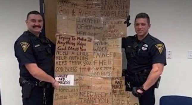 Image for article titled Alabama Police Poses With &#39;Quilt&#39; Made from Signs of the Homeless