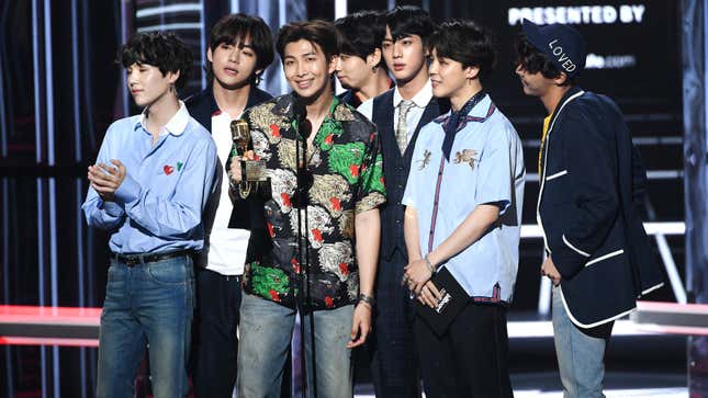 BTS accepting an award at the Billboard Music Awards.