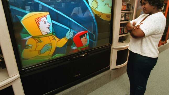 Donna Carter watches an HDTV monitor Sept. 20, 2000 at Douglas TV-Big Screen Store in Mount Prospect, IL.