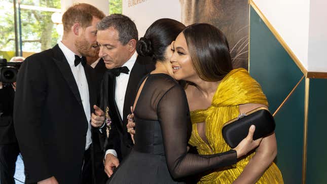 Prince Harry, Duke of Sussex (L) chats with Disney CEO Robert Iger as Meghan, Duchess of Sussex (2nd R) embraces Beyoncé (R) as they attend the European premiere of the film The Lion King on July 14, 2019. 