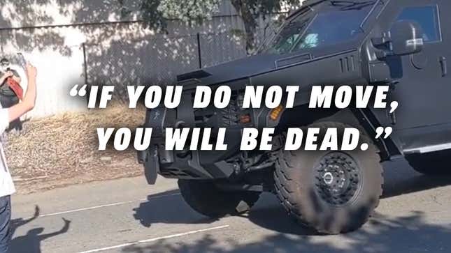 Image for article titled Cop In Armored Truck Tells Peaceful Protesters: &#39;If You Do Not Move You Will Be Dead&#39; [Updated: New Audio]