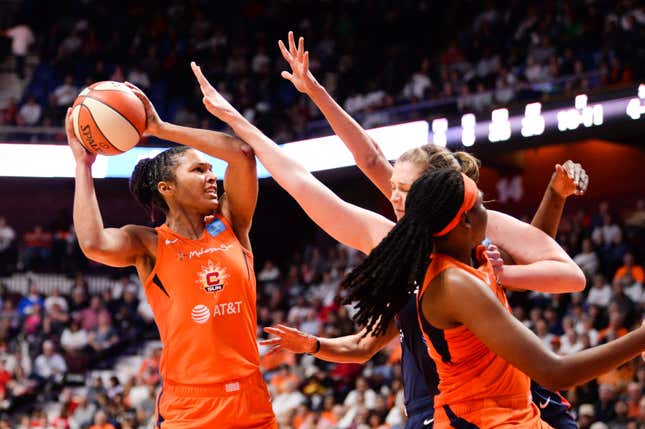 Alyssa Thomas, No. 25, of the Connecticut Sun is defended by the Washington Mystics in the fourth quarter of Game 3 of the WNBA Finals at Mohegan Sun Arena on October 6, 2019 in Uncasville, Connecticut. 