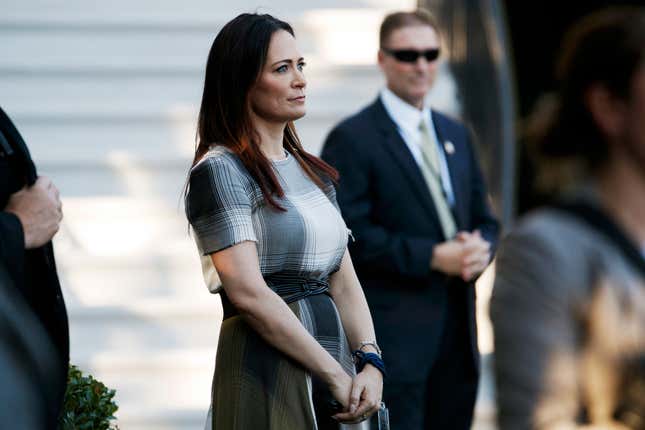 In this June 21, 2019 photo, Stephanie Grisham, spokeswoman for first lady Melania Trump, watches as President Donald Trump and the first lady greet attendees during the annual Congressional Picnic on the South Lawn in Washington.