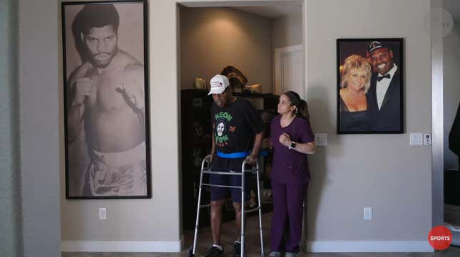 Former heavyweight champion Leon Spinks walks around his home during a physical training session.