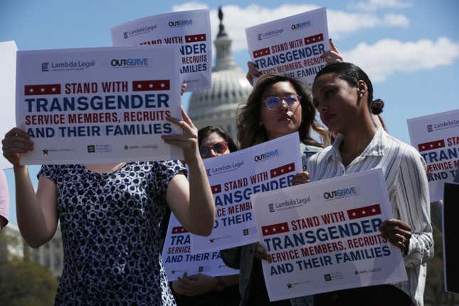 Activists rally at the U.S. Capitol April 10, 2019, against the transgender military service ban.