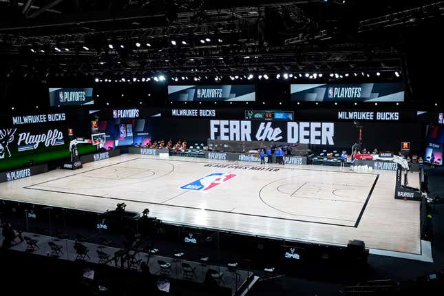 Officials stand beside an empty court after the scheduled start of game five between the Milwaukee Bucks and the Orlando Magic in the first round of the 2020 NBA Playoffs at AdventHealth Arena at ESPN Wide World Of Sports Complex on August 26, 2020 in Lake Buena Vista, Florida. (Photo by Ashley Landis-Pool/Getty Images)