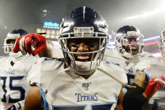 Logan Ryan #26 of the Tennessee Titans celebrates his touchdown with teammates against the New England Patriots in the fourth quarter of the AFC Wild Card Playoff game at Gillette Stadium on January 04, 2020 in Foxborough, Massachusetts.