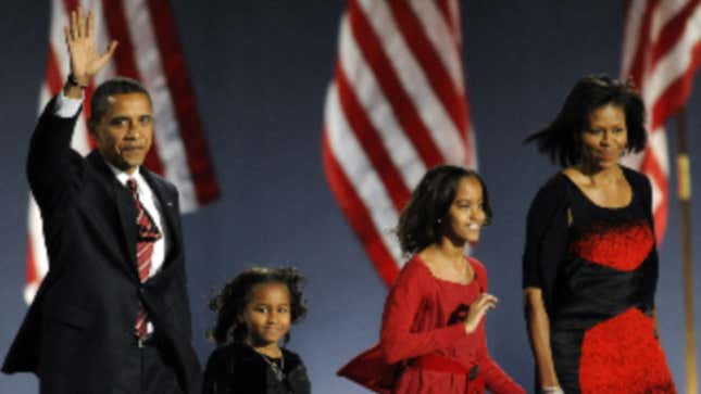 Democratic then-presidential candidate Barack Obama and his family arrive on stage for his election night victory rally on November 4, 2008, in Chicago, Illinois.