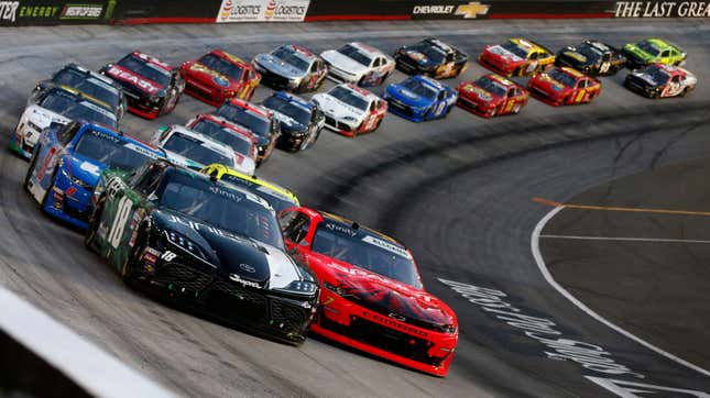 Kyle Busch in the front of an Xfinity Series field at Bristol Motor Speedway.