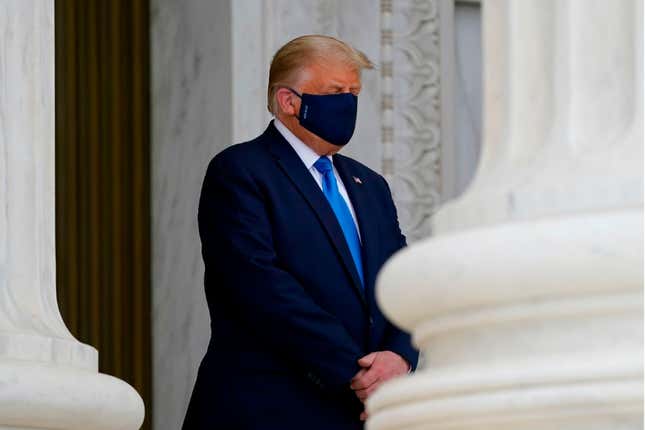  President Donald Trump pays his respects to US Supreme Court Justice Ruth Bader Ginsburg as she lies in repose in front of the Supreme Court in Washington, DC, on September 24, 2020.