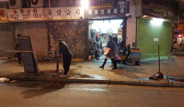Image for article titled The Most Dedicated Mechanics In The World Wrench On The Streets Of Hong Kong