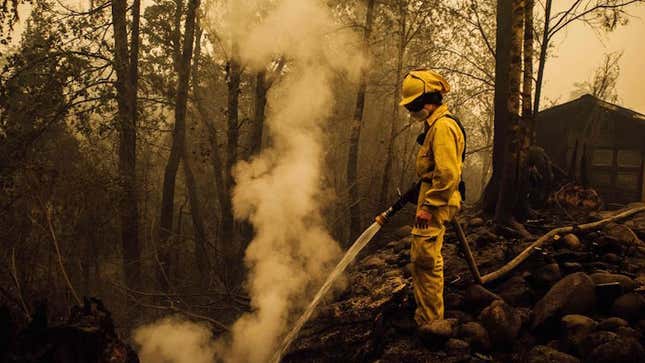 Volunteer firefighter Jacob Ruthrock puts out embers from a fire in Gates, Oregon, on September 10, 2020