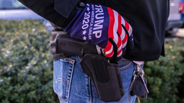 A right-wing protester rests his hand on a pistol on October 30, 2020 in Vancouver, Washington.