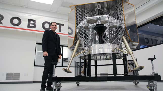 Astrobotic systems engineer Ander Solorzano stands beside a test model of the company’s Peregrine lunar lander currently in development. It’s set to be the first American lander on the Moon since the Apollo missions.