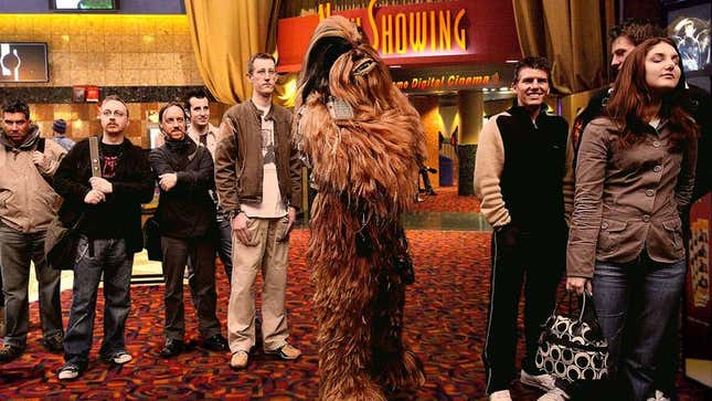Image for article titled Guy Wearing Chewbacca Costume Torn Between Seeing ‘Star Wars’ And ‘The Big Short’