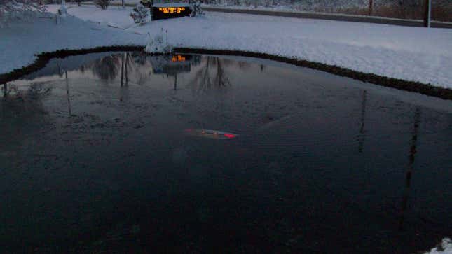 Image for article titled I Am Taken By The Ethereal Beauty Of This Car Crashed Into A Pond