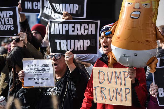 People participate in a protest against U.S. President Donald Trump on Veterans Day on November 11, 2019 in New York City.