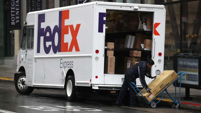 A FedEx worker stacks packages on a cart on December 02, 2019 in San Francisco, California. 