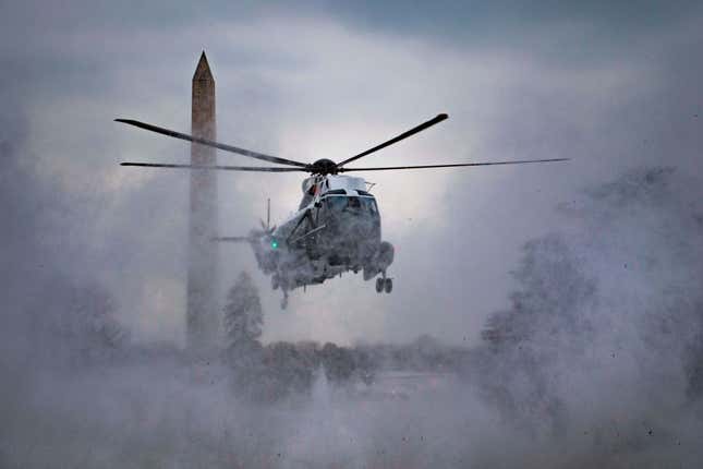 Marine One kicks up snow as it lands on the South Lawn of the White House in Washington, DC, on Feb. 1, 2019, to convey US President Donald Trump to Andrews Air Force Base in neighboring Maryland. Trump is traveling to Palm Beach, Fla. 