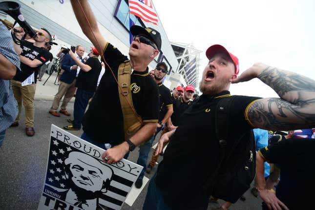 Members of the Proud Boys face off against anti-Trump protesters outside a rally where President Trump officially launched his re-election campaign on June 18, 2019 in Orlando, Florida.