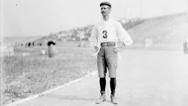 Cuban long-distance runner Félix de la Caridad Carvajal y Soto, known as Andarín Carvajal, standing on the track of an athletic field in St. Louis, Missouri, during the 1904 Olympic Games