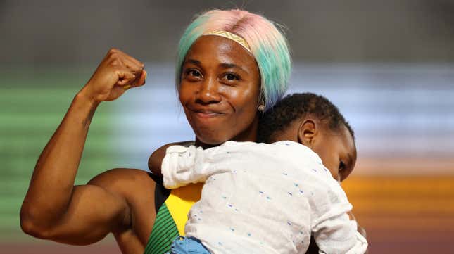 Shelly-Ann Fraser-Pryce of Jamaica celebrates with her son Zyon after winning the Women’s 100 Metres final during day three of 17th IAAF World Athletics Championships Doha 2019 on Sept. 29, 2019, in Doha, Qatar.