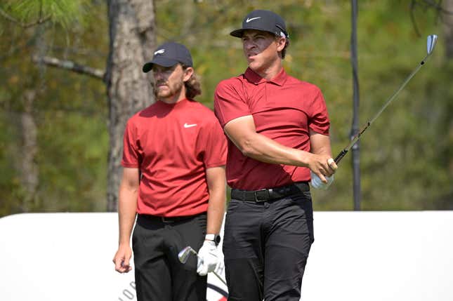 Tommy Fleetwood, left, of England, and Cameron Champ watch his tee shot on the 11th hole during the final round of the Workday Championship golf tournament Sunday, Feb. 28, 2021, in Bradenton, Fla.