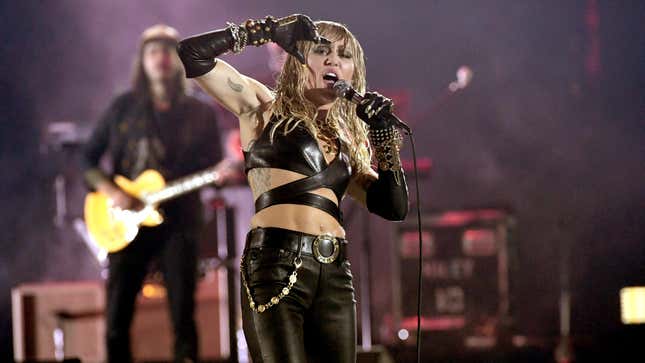 Image for article titled Miley Cyrus Joins Myspace in Spirit, Gets 'Rock n Roll' Heart Tattoo