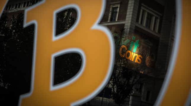 A Bitcoin sign is seen at the entrance of a cryptocurrency exchange office on April 16, 2021 in Istanbul, Turkey.