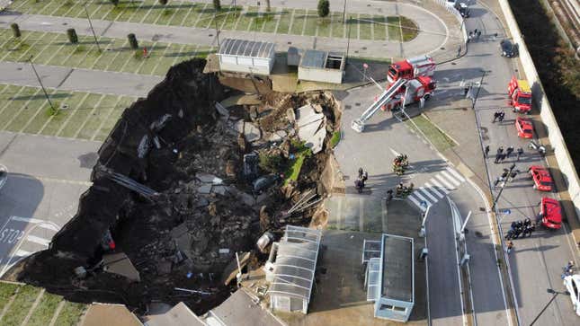 An aerial view shows a sinkhole in the Ospedale del Mare hospital car park.