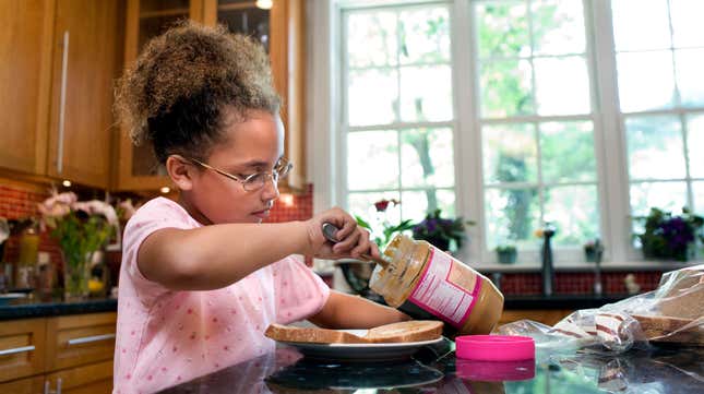 Image for article titled Why do peanut butter jars have those hard-to-scrape rims?