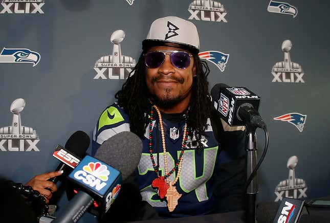 Running back Marshawn Lynch #24 of the Seattle Seahawks speaks during a Super Bowl XLIX media availability at the Arizona Grand Hotel on January 28, 2015 in Chandler, Arizona.