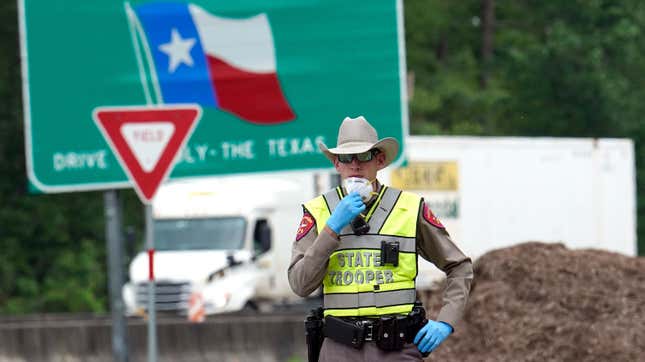 Image for article titled How Many Cops, Military Vehicles and Drones Does it Take to Pull Over a Woman and Her Chihuahua?